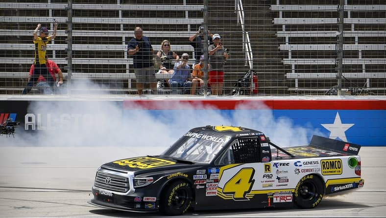 Jun 12, 2021; Fort Worth, TX, USA; NASCAR Camping World Truck Series driver John Hunter Nemechek (4) performs a burnout after he wins the SpeedyCash.com 220 race at the Texas Motor Speedway. Mandatory Credit: Jerome Miron-USA TODAY Sports