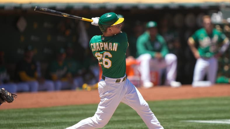 Jun 13, 2021; Oakland, California, USA; Oakland Athletics third baseman Matt Chapman (26) hits a solo home run during the first inning against the Kansas City Royals at RingCentral Coliseum. Mandatory Credit: Stan Szeto-USA TODAY Sports