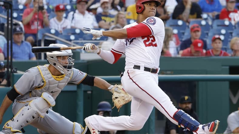 Jun 15, 2021; Washington, District of Columbia, USA; Washington Nationals left fielder Juan Soto (22) singles against the Pittsburgh Pirates in the first inning at Nationals Park. Mandatory Credit: Geoff Burke-USA TODAY Sports