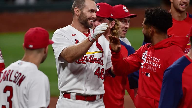 Jun 15, 2021; St. Louis, Missouri, USA;  St. Louis Cardinals first baseman Paul Goldschmidt (46) is congratulated by teammates at home plate after hitting a walk off solo home run during the ninth inning against the Miami Marlins at Busch Stadium. Mandatory Credit: Jeff Curry-USA TODAY Sports