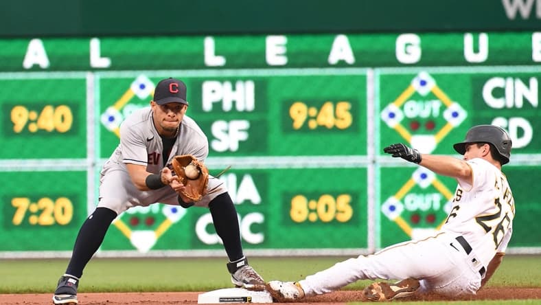 Jun 18, 2021; Pittsburgh, Pennsylvania, USA;  Pittsburgh Pirates base runner Adam Frazier (26) slides safely into second as the Cleveland Indians Cesar Hernandez (left) catches the ball at PNC Park. Mandatory Credit: Philip G. Pavely-USA TODAY Sports