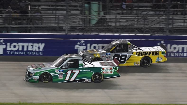 Jun 18, 2021; Nashville, TN, USA; NASCAR Truck Series driver Ryan Preece (17) passes NASCAR Truck Series driver Grant Enfinger (98) in the final stage of the Rackley Roofing 200 at Nashville Superspeedway. Mandatory Credit: Christopher Hanewinckel-USA TODAY Sports