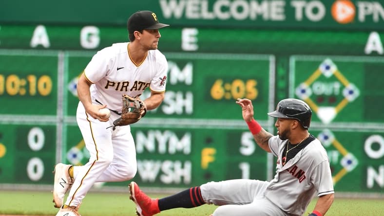 Jun 19, 2021; Pittsburgh, Pennsylvania, USA; Pittsburgh Pirates second baseman Adam Frazier forces out Cleveland Indians base runner Eddie Rosario rduring the fourth inning at PNC Park. Mandatory Credit: Philip G. Pavely-USA TODAY Sports