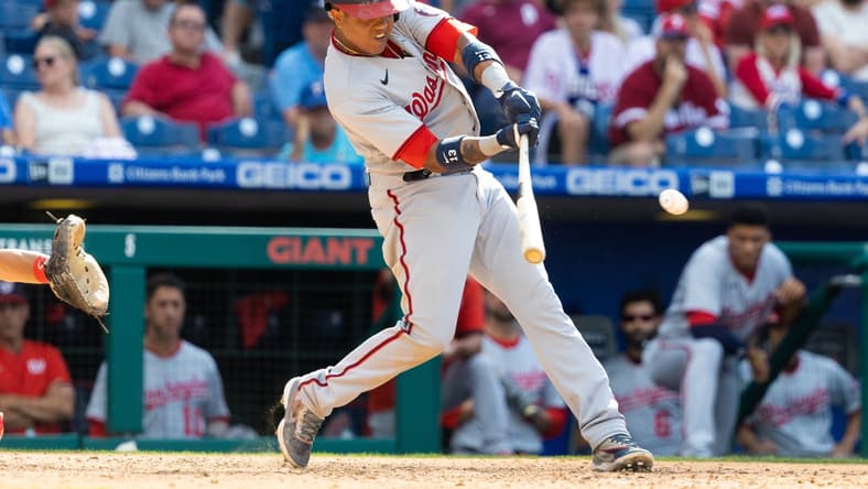 Jun 23, 2021; Philadelphia, Pennsylvania, USA; Washington Nationals second baseman Starlin Castro (13) hits a two RBI single during the ninth inning against the Philadelphia Phillies at Citizens Bank Park. Mandatory Credit: Bill Streicher-USA TODAY Sports