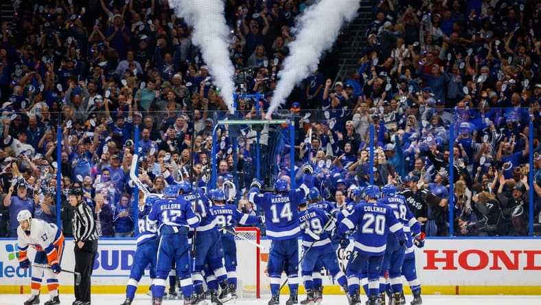 Jun 25, 2021; Tampa, Florida, USA; Tampa Bay Lightning celebrate after beating the New York Islanders 1-0 in game seven of the Stanley Cup Semifinals at Amalie Arena. Mandatory Credit: Nathan Ray Seebeck-USA TODAY Sports