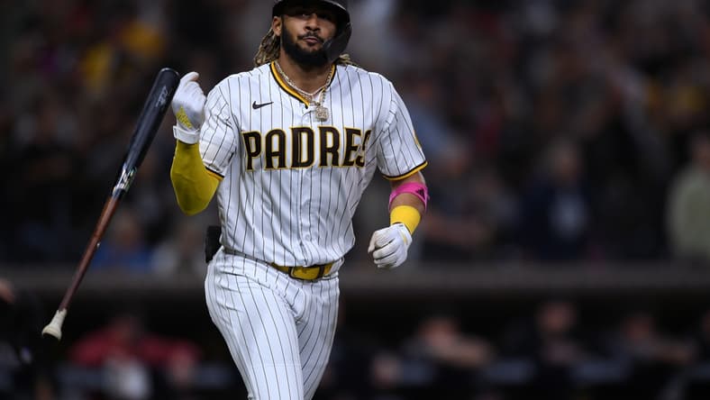 Jun 25, 2021; San Diego, California, USA; San Diego Padres shortstop Fernando Tatis Jr. (23) flips his bat after hitting a two-run home run against the Arizona Diamondbacks during the fourth inning at Petco Park. Mandatory Credit: Orlando Ramirez-USA TODAY Sports