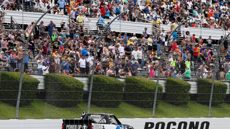 Jun 26, 2021; Long Pond, PA, USA; NASCAR Camping World Truck Series driver John Hunter Nemechek (4) celebrates after winning the CRC Brakleen 150 at Pocono Raceway. Mandatory Credit: Matthew OHaren-USA TODAY Sports
