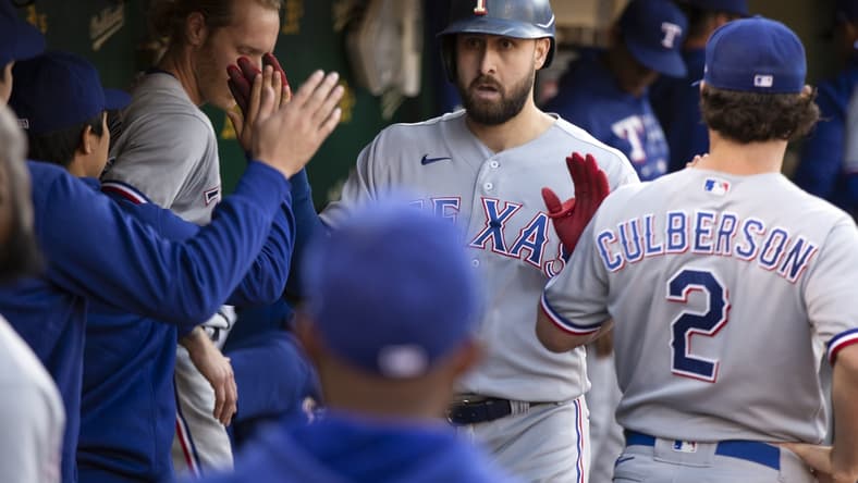 Jun 29, 2021; Oakland, California, USA; Texas Rangers right fielder Joey Gallo is greeted by his teammates after hitting a solo home run against the Oakland Athletics during the fourth inning at RingCentral Coliseum. Mandatory Credit: D. Ross Cameron-USA TODAY Sports