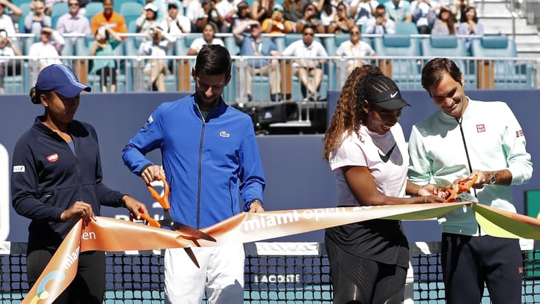Mar 20, 2019; Miami Gardens, FL, USA; (L-R) Naomi Osaka of Japan, Novak Djokovic of Serbia, Serena Williams of the United States, and Roger Federer of Switzerland participate in a ribbon cutting ceremony on new stadium court at Hard Rock Stadium prior to play in the first round of the Miami Open at Miami Open Tennis Complex. Mandatory Credit: Geoff Burke-USA TODAY Sports