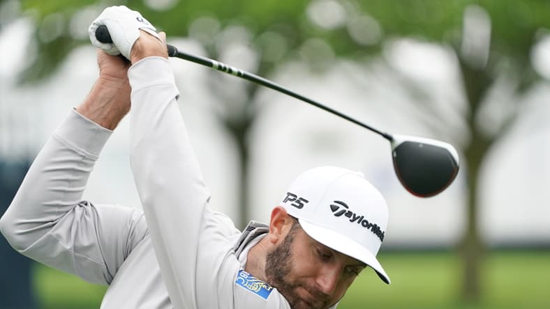 May 13, 2019; Farmingdale, NY, USA; Dustin Johnson practices on the driving range during practice for the PGA Championship golf tournament at Bethpage State Park - Black Course. Mandatory Credit: John David Mercer-USA TODAY Sports