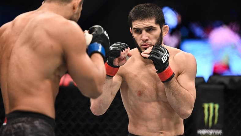 Sep 7, 2019; Abu Dhabi, UAE; Islam Makhachev (red gloves) fights Davi Ramos (blue gloves) during UFC 242 at The Arena. Mandatory Credit: Per Haljestam-USA TODAY Sports