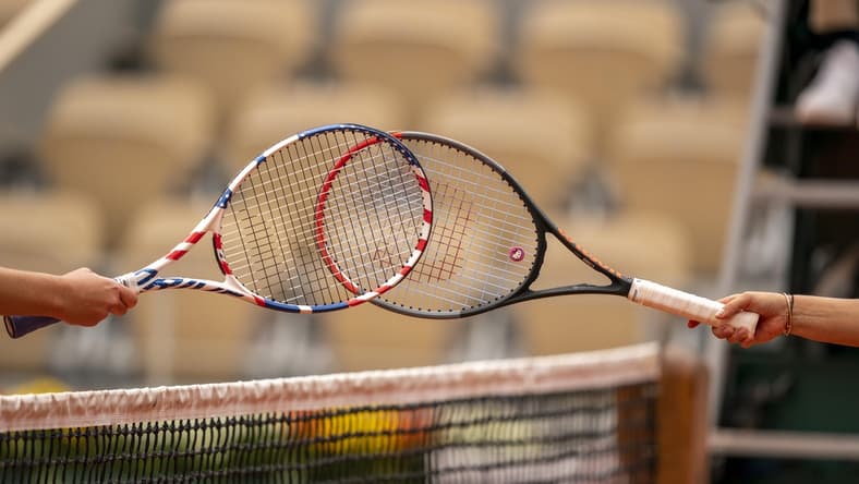 Oct 3, 2020; Paris, France; Players touch rackets after the Irina Bara (ROU) and Sofia Kenin (USA) match on day seven at Stade Roland Garros. Mandatory Credit: Susan Mullane-USA TODAY Sports