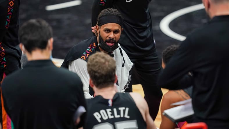 Jan 22, 2021; San Antonio, Texas, USA; San Antonio Spurs guard Patty Mills (8) talks to his team during a timeout in the second half against the Dallas Mavericks at the AT&T Center. Mandatory Credit: Daniel Dunn-USA TODAY Sports