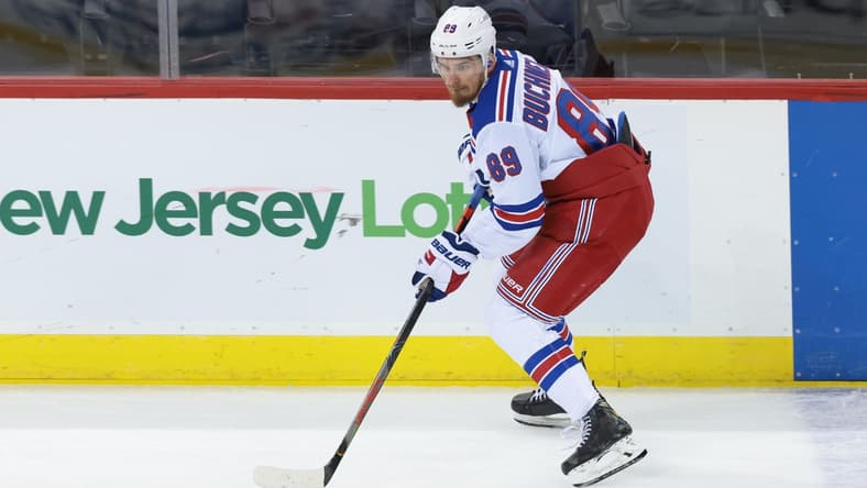 Apr 18, 2021; Newark, New Jersey, USA; New York Rangers right wing Pavel Buchnevich (89) skates with the puck against the New Jersey Devils during the second period at Prudential Center. Mandatory Credit: Vincent Carchietta-USA TODAY Sports