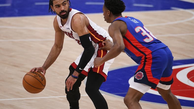May 16, 2021; Detroit, Michigan, USA; Miami Heat guard Gabe Vincent (2) drives to the basket as Detroit Pistons guard Saben Lee (38) defends during the fourth quarter at Little Caesars Arena. Mandatory Credit: Tim Fuller-USA TODAY Sports