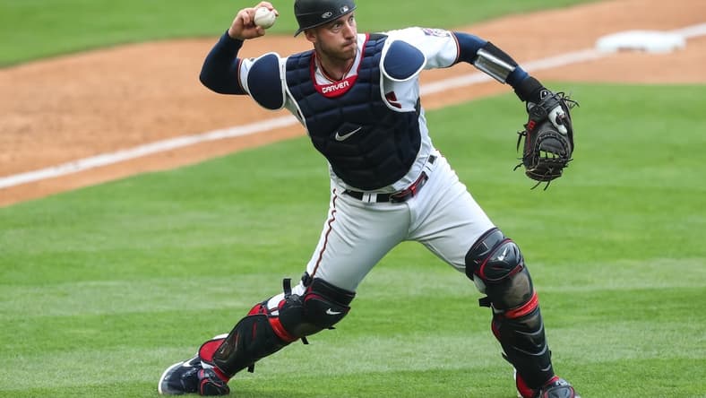 May 30, 2021; Minneapolis, Minnesota, USA; Minnesota Twins catcher Mitch Garver (8) throws the ball to first base against the Kansas City Royals in the ninth inning at Target Field. Mandatory Credit: David Berding-USA TODAY Sports