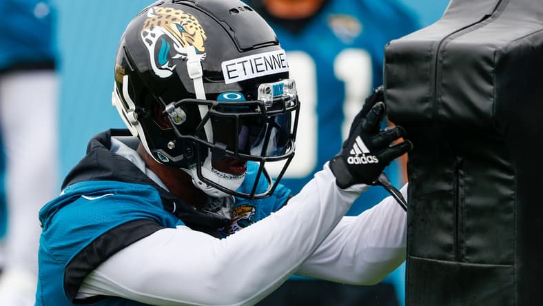 Jun 14, 2021; Jacksonville, Florida, USA;  Jacksonville Jaguars running back Travis Etienne Jr. (1) participates in a blocking drill during minicamp at Dream Finders Homes practice complex Mandatory Credit: Nathan Ray Seebeck-USA TODAY Sports