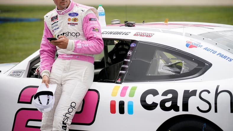 NASCAR Xfinity Series driver Austin Cindric (22) checks his phone prior to the Tennessee Lottery 250 NASCAR Xfinity Series race at the Nashville Superspeedway in Lebanon, Tenn., Saturday, June 19, 2021.

Nascar X 002