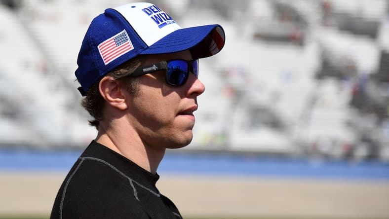 Jun 20, 2021; Nashville, Tennessee, USA; NASCAR Cup Series driver Brad Keselowski (2) waits beside his car before qualifying for the Ally 400 at Nashville Superspeedway. Mandatory Credit: Christopher Hanewinckel-USA TODAY Sports