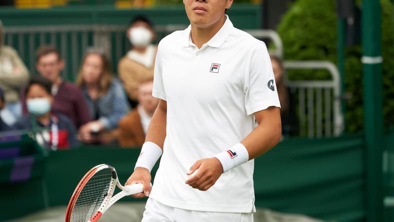 Jun 29, 2021; London, United Kingdom; Brandon Nakashima  (USA) seen on court against compatriot  Taylor Fritz (USA) in first round  singles on No. 16 court at All England Lawn Tennis and Croquet Club. Fritz ran out the winner 7-5  3-6  6-6  7-5.  Mandatory Credit: Peter van den Berg-USA TODAY Sports