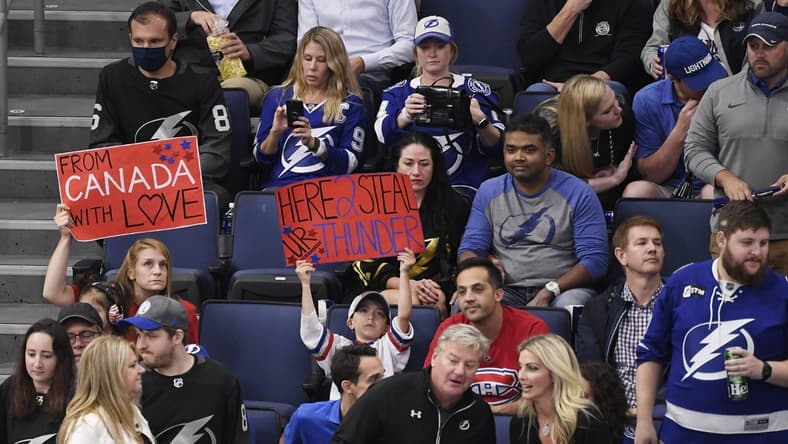Jun 30, 2021; Tampa, Florida, USA; Montreal Canadiens fans sit between Tampa Bay Lightning fans during the third period in game two of the 2021 Stanley Cup Final at Amalie Arena. Mandatory Credit: Douglas DeFelice-USA TODAY Sports