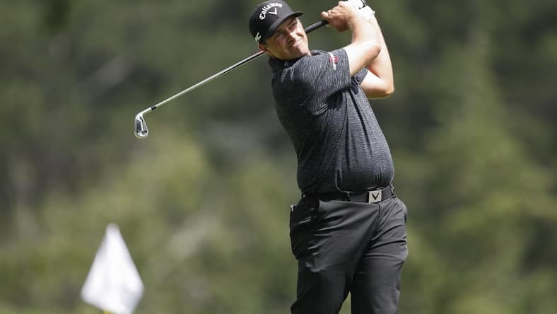 Jul 1, 2021; Detroit, Michigan, USA; Brian Stuard hits his tee shot on the 9th hole during the first round of the Rocket Mortgage Classic golf tournament. Mandatory Credit: Raj Mehta-USA TODAY Sports