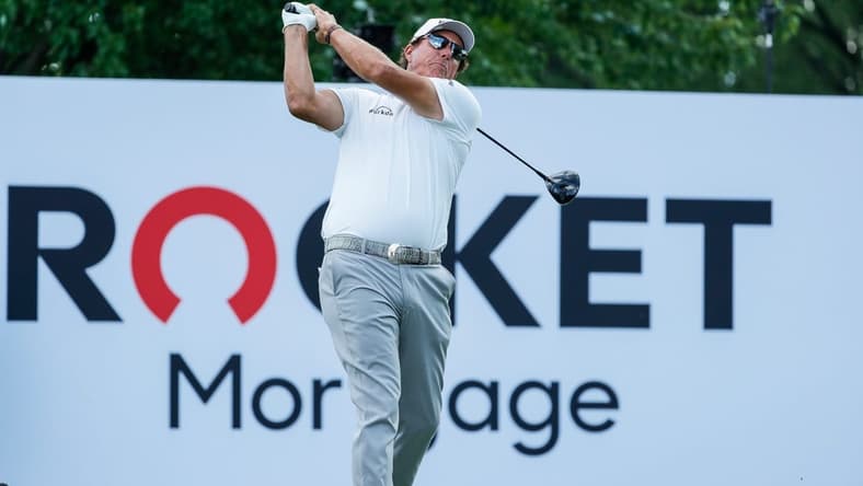Phil Mickelson tees off on the 18th during the second round of the Rocket Mortgage Classic at the Detroit Golf Club in Detroit on Friday, July 2, 2021.