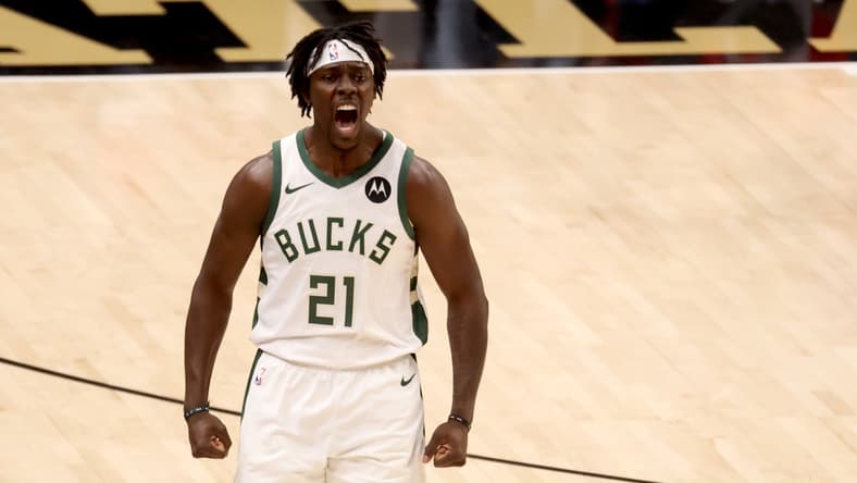 Jul 3, 2021; Atlanta, Georgia, USA; Milwaukee Bucks guard Jrue Holiday (21) reacts after a basket during the first quarter against the Atlanta Hawks in game six of the Eastern Conference Finals for the 2021 NBA Playoffs at State Farm Arena. Mandatory Credit: Jason Getz-USA TODAY Sports