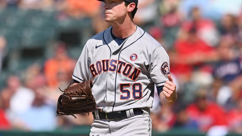 Jul 4, 2021; Cleveland, Ohio, USA; Houston Astros relief pitcher Brooks Raley (58) celebrates after striking out Cleveland Indians pinch hitter Oscar Mercado (not pictured) to end the game at Progressive Field. Mandatory Credit: Ken Blaze-USA TODAY Sports