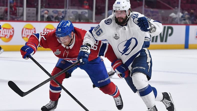 Jul 5, 2021; Montreal, Quebec, CAN; Montreal Canadiens left wing Artturi Lehkonen (62) skates against Tampa Bay Lightning right wing Nikita Kucherov (86) during the third period in game four of the 2021 Stanley Cup Final at the Bell Centre. Mandatory Credit: Eric Bolte-USA TODAY Sports