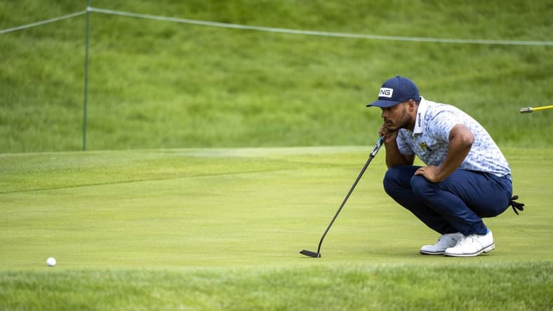 Jul 9, 2021; Silvis, Illinois, USA; Sebastian Munoz lines up his putt on the 17th hole during the second round of the John Deere Classic golf tournament. Mandatory Credit: Marc Lebryk-USA TODAY Sports