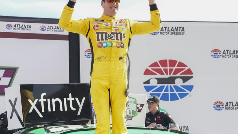 Jul 10, 2021; Hampton, GA, USA; NASCAR Xfinity Series driver Kyle Busch (54) celebrates after winning the Credit Karma 250 at Atlanta Motor Speedway. Mandatory Credit: Marvin Gentry-USA TODAY Sports