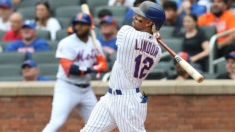 Jul 11, 2021; New York City, New York, USA; New York Mets shortstop Francisco Lindor (12) hits a two-run home run against the Pittsburgh Pirates during the first inning at Citi Field. Mandatory Credit: Andy Marlin-USA TODAY Sports