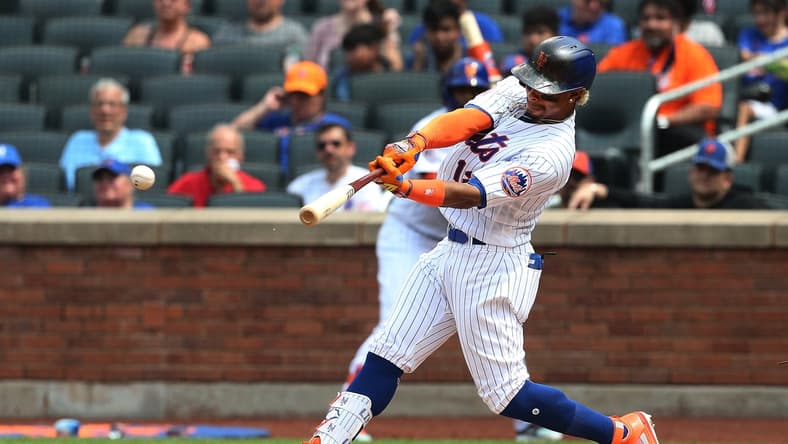 Jul 11, 2021; New York City, New York, USA; New York Mets shortstop Francisco Lindor (12) singles against the Pittsburgh Pirates during the fifth inning at Citi Field. Mandatory Credit: Andy Marlin-USA TODAY Sports
