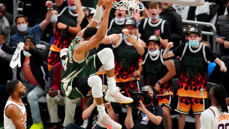Jul 11, 2021; Milwaukee, Wisconsin, USA; Milwaukee Bucks forward Giannis Antetokounmpo (34) dunks against the Phoenix Suns during game three of the 2021 NBA Finals at Fiserv Forum. Mandatory Credit: Mark J. Rebilas-USA TODAY Sports