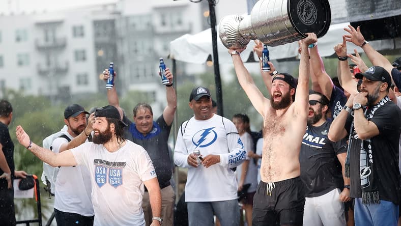 Jul 12, 2021; Tampa, FL, USA;  Tampa Bay Lightning right wing Nikita Kucherov (86) hoists the Stanley Cup during the Stanley Cup Championship parade. Mandatory Credit: Kim Klement-USA TODAY Sports