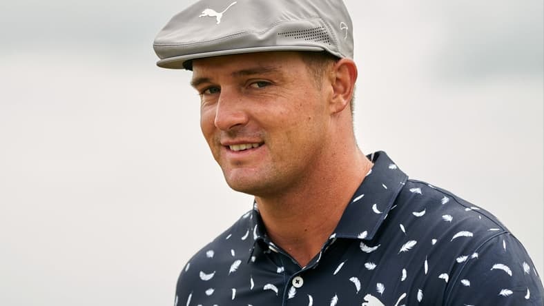 Jul 15, 2021; Sandwich, England, GBR; Bryson DeChambeau looks on from the thirteenth green during the first round of the Open Championship golf tournament. Mandatory Credit: Peter van den Berg-USA TODAY Sports