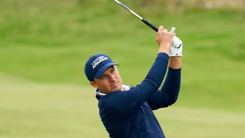 Jul 15, 2021; Sandwich, England, GBR; Jordan Spieth plays his shot from the thirteenth fairway during the first round of the Open Championship golf tournament. Mandatory Credit: Peter van den Berg-USA TODAY Sports