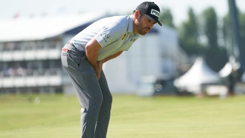 Jul 17, 2021; Sandwich, England, GBR; Louis Oosthuizen reacts to his putt on the first green during the third round of the Open Championship golf tournament. Mandatory Credit: Peter van den Berg-USA TODAY Sports