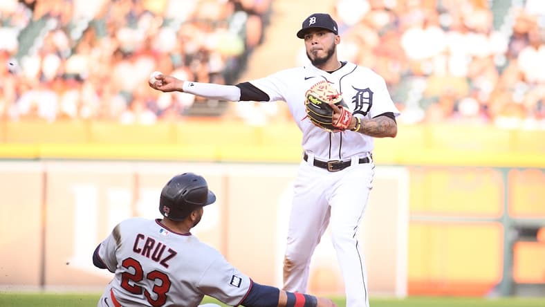Jul 17, 2021; Detroit, Michigan, USA; Detroit Tigers second baseman Harold Castro (right) forces Minnesota Twins designated hitter Nelson Cruz (23) out at second base and throws to first base during the fifth inning at Comerica Park. Mandatory Credit: Tim Fuller-USA TODAY Sports