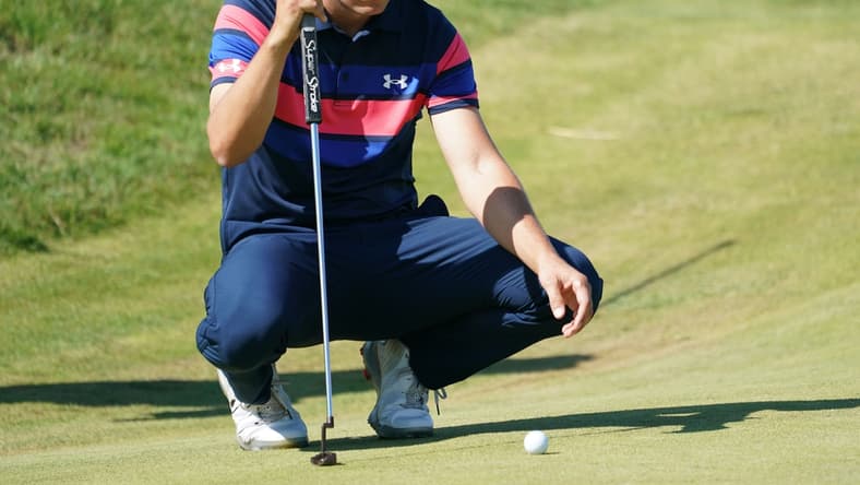 Jul 18, 2021; Sandwich, England, GBR; Jordan Spieth lines up a putt on the eighth green during the final round of the Open Championship golf tournament. Mandatory Credit: Peter van den Berg-USA TODAY Sports
