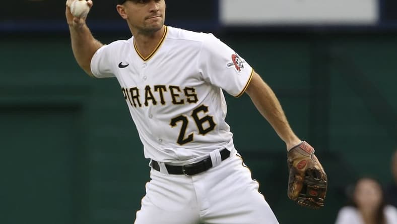 Jul 16, 2021; Pittsburgh, Pennsylvania, USA;  Pittsburgh Pirates second baseman Adam Frazier (26) throws to first base to record an out against the New York Mets during the first inning at PNC Park. Mandatory Credit: Charles LeClaire-USA TODAY Sports
