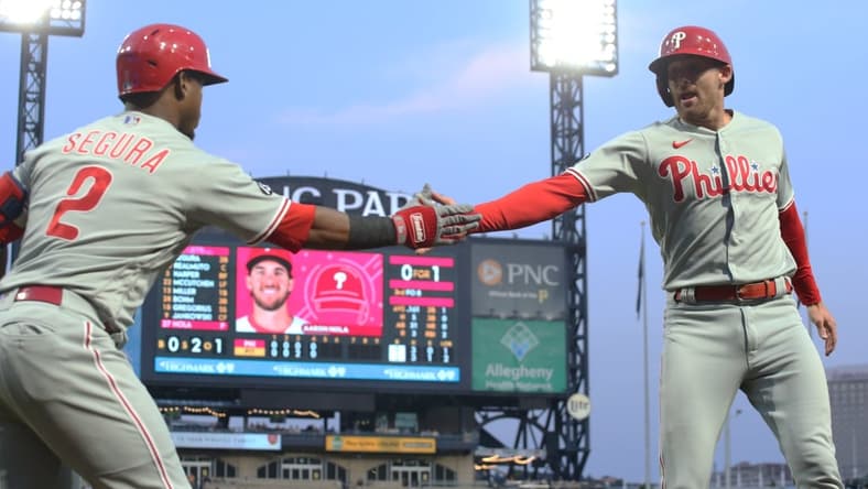 Jul 31, 2021; Pittsburgh, Pennsylvania, USA; Philadelphia Phillies second baseman Jean Segura (2) congratulates first baseman Brad Miller (13) after Miller scored a run against the Pittsburgh Pirates during the fifth inning at PNC Park. Mandatory Credit: Charles LeClaire-USA TODAY Sports