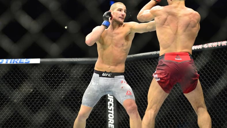 Oct 27, 2018; Moncton, Canada; Nordine Taleb (red gloves) fights Sean Strickland (blue gloves) during UFC Fight Night at Moncton Events Centre. Mandatory Credit: Trevor MacMillan-USA TODAY Sports