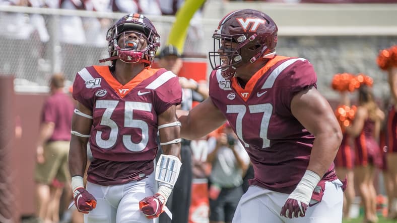 Sep 7, 2019; Blacksburg, VA, USA; Virginia Tech Hokies running back Keshawn King (35) celebrates his first touch down with Christian Darrisaw (77) in the first period against the Old Dominion Monarchs at Lane Stadium. Mandatory Credit: Lee Luther Jr.-USA TODAY Sports