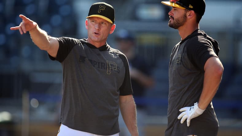Sep 17, 2019; Pittsburgh, PA, USA;  Pittsburgh Pirates hitting coach Rick Eckstein (left) talks with left fielder Kevin Kramer (right) at the batting cage before the game against the Seattle Mariners at PNC Park. Mandatory Credit: Charles LeClaire-USA TODAY Sports