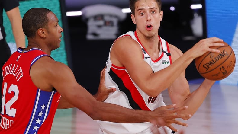 Aug 9, 2020; Lake Buena Vista, Florida, USA;  Zach Collins #33 of the Portland Trail Blazers looks to pass against Al Horford #42 of the Philadelphia 76ers at Visa Athletic Center at ESPN Wide World Of Sports Complex on August 09, 2020 in Lake Buena Vista, Florida.  Mandatory Credit: Kevin C. Cox/Pool Photo-USA TODAY Sports