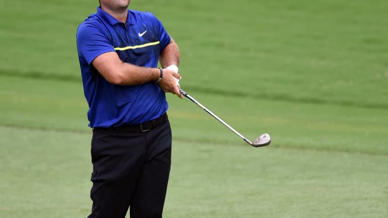 Aug 14, 2020; Greensboro, North Carolina, USA; Patrick Reed watches his approach shot on the ninth hole during the second round of the Wyndham Championship golf tournament at Sedgefield Country Club. Mandatory Credit: Rob Kinnan-USA TODAY Sports