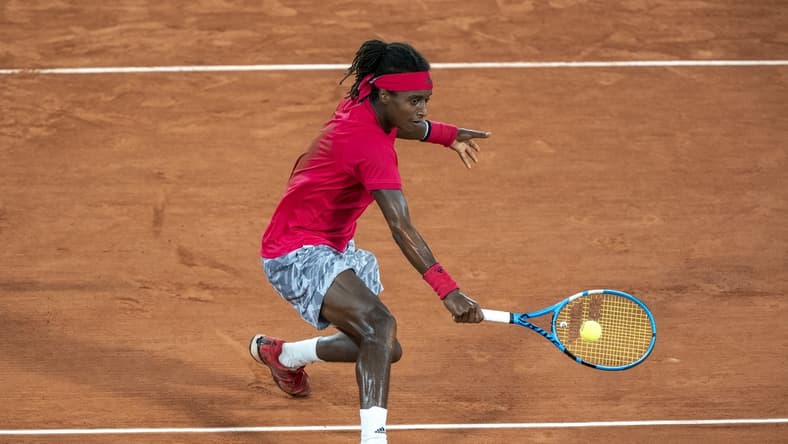 Sep 29, Paris, France; Mikael Ymer (SWE) in action during his match against Novak Djokovic (SRB) on day three at Stade Roland Garros. Mandatory Credit: Susan Mullane-USA TODAY Sports