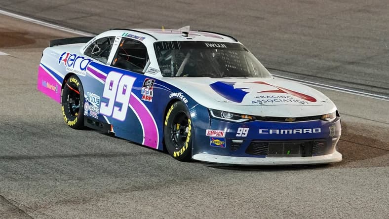Oct 17, 2020; Kansas City, Kansas, USA; NASCAR Xfinity Series driver Jesse Iwuji (99) races during the Kansas Lottery 300 at Kansas Speedway. Mandatory Credit: Jay Biggerstaff-USA TODAY Sports